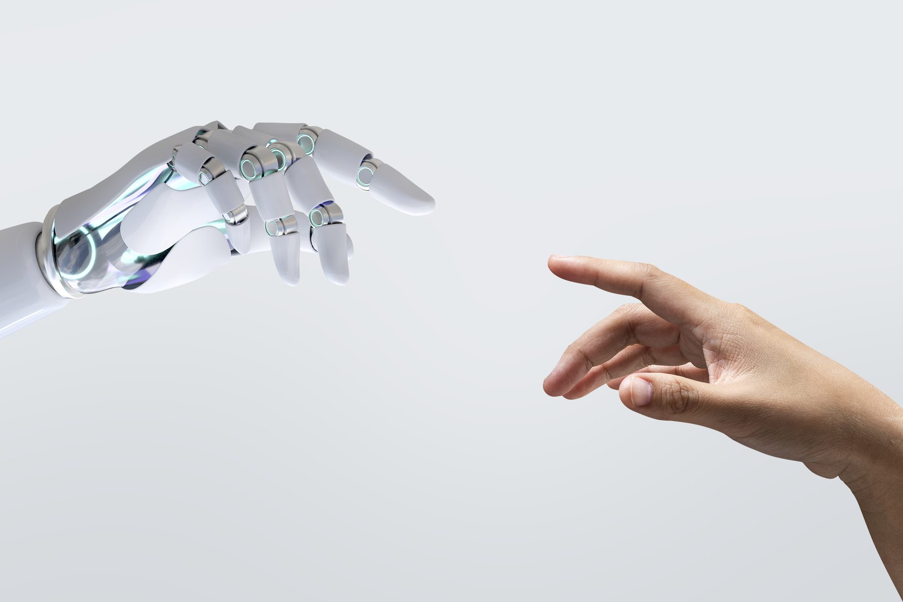 A robotic hand reaching toward a human hand